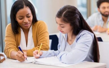 Students taking notes during a class