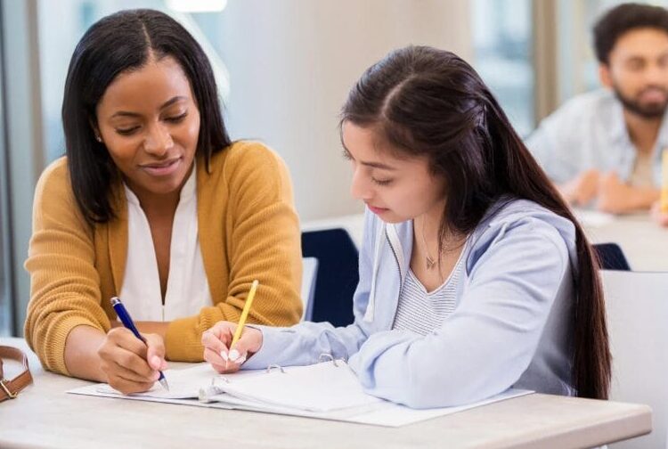 Students taking notes during a class