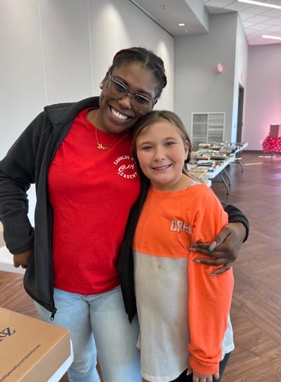 teacher and student smiling