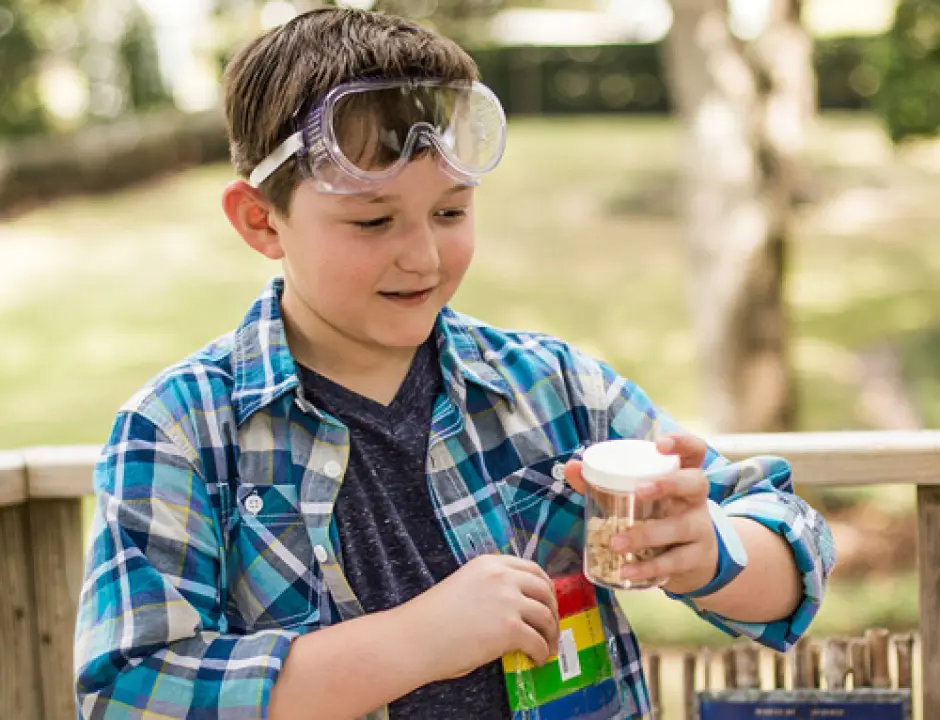 Boy playing and wearing goggles