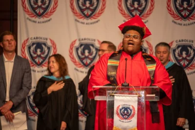 student saying words at graduation