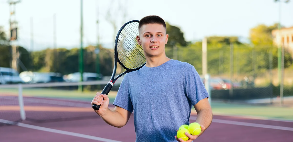 boy playing tennis