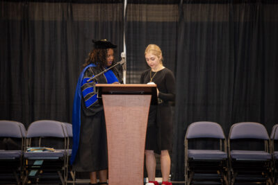 teachers preparing the microphone at the graduation